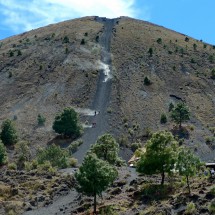 Volcan Paricutin with people heading down in the ash and scree of the summit gully